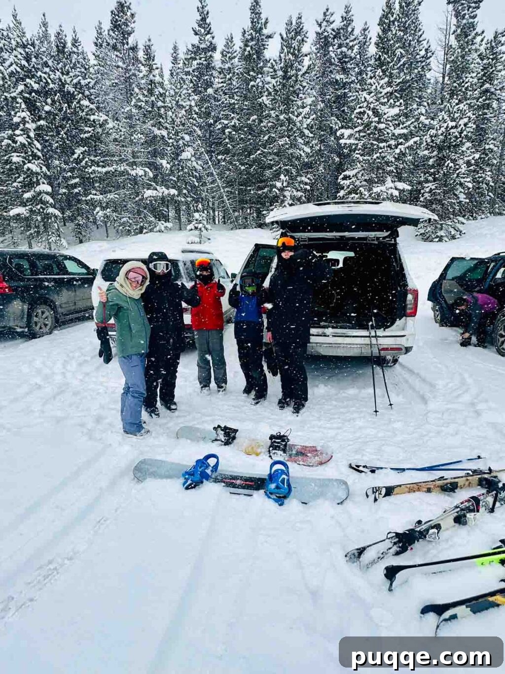 Big Sky Resort: The Ultimate Family Guide 9 Family getting ready to ski, posing by their car in the carpool lot at Big Sky.