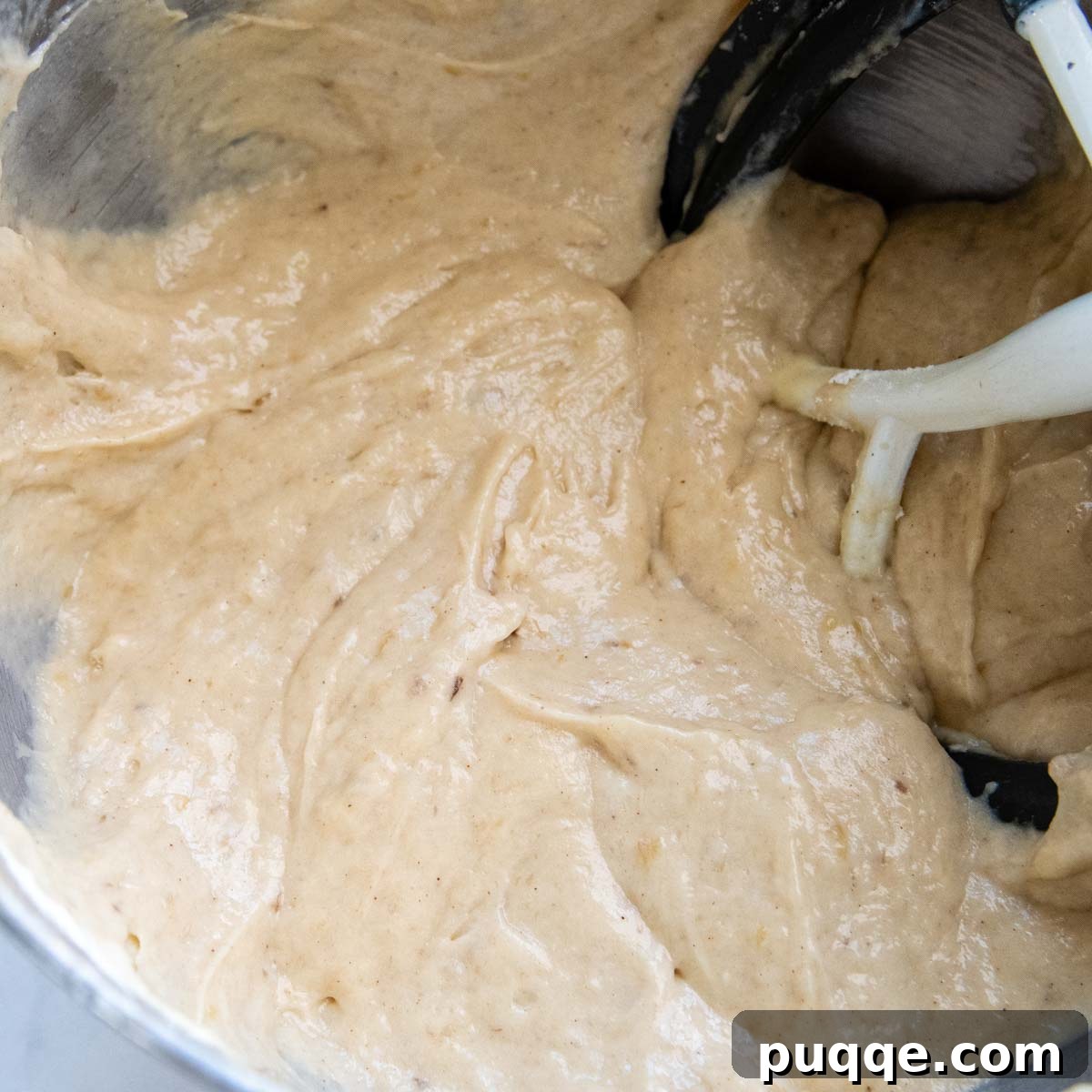 Cloud-Like Gluten-Free Banana Cake 7 The completed, thick banana cake batter in a mixing bowl, ready to be divided into cake pans.
