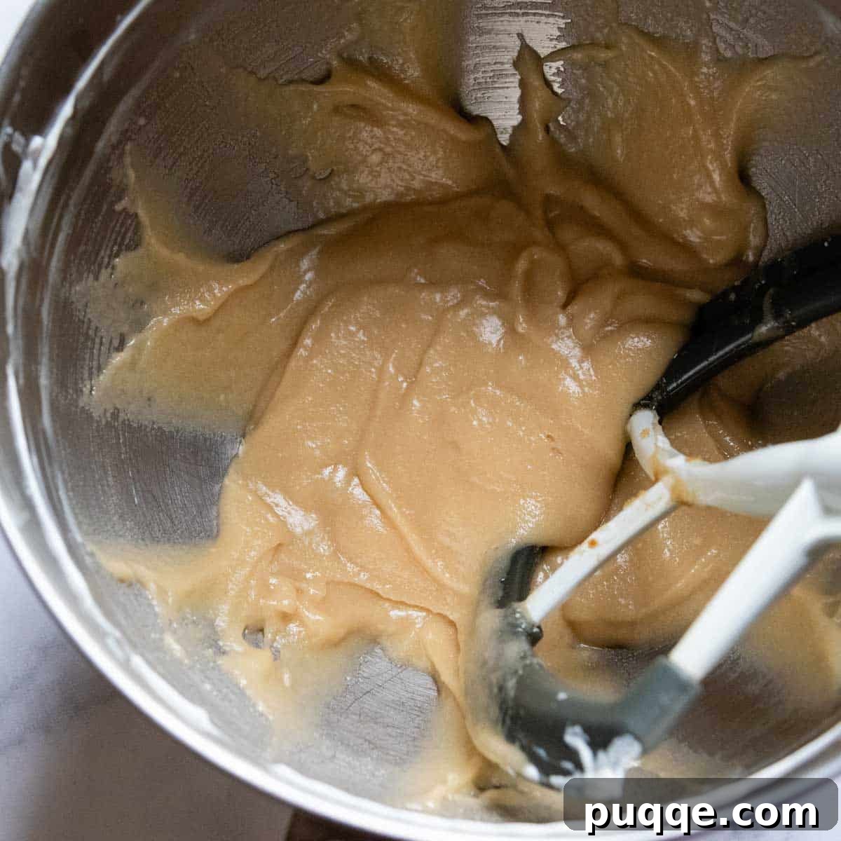 Tropical & Tender Gluten-Free Hummingbird Cake 3 The blended mixture of butter, oil, sour cream, and sugars in a mixing bowl, creating a creamy base for the cake batter.