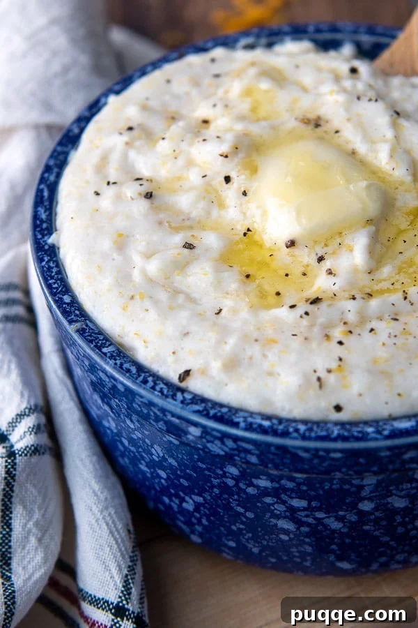 A close-up of butter melting on a warm bowl of creamy grits, ready to be enjoyed.