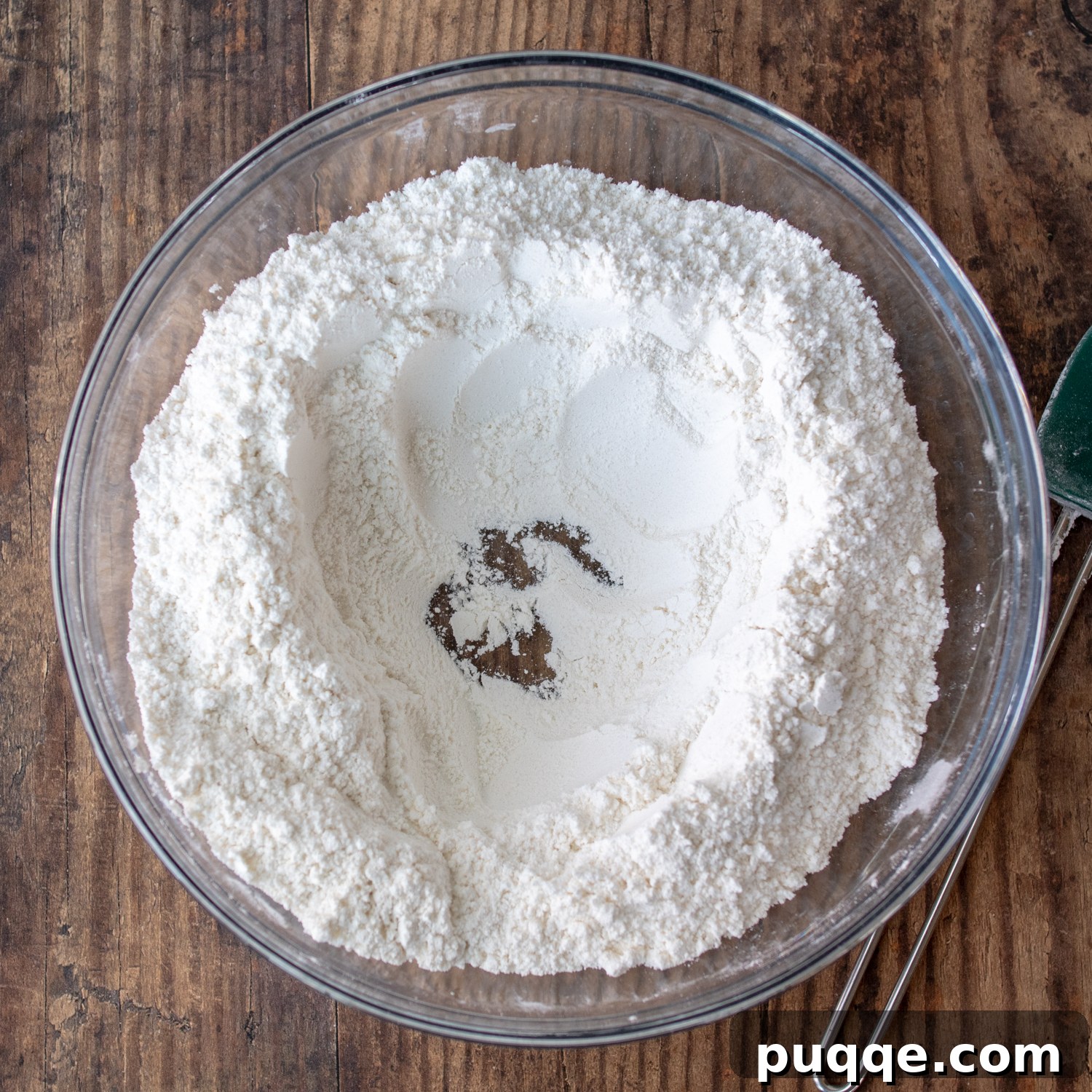 Melt-in-Your-Mouth Sweet Irish Soda Bread 3 Dry ingredients in a large glass mixing bowl with a visible well formed in the center, ready for liquid.