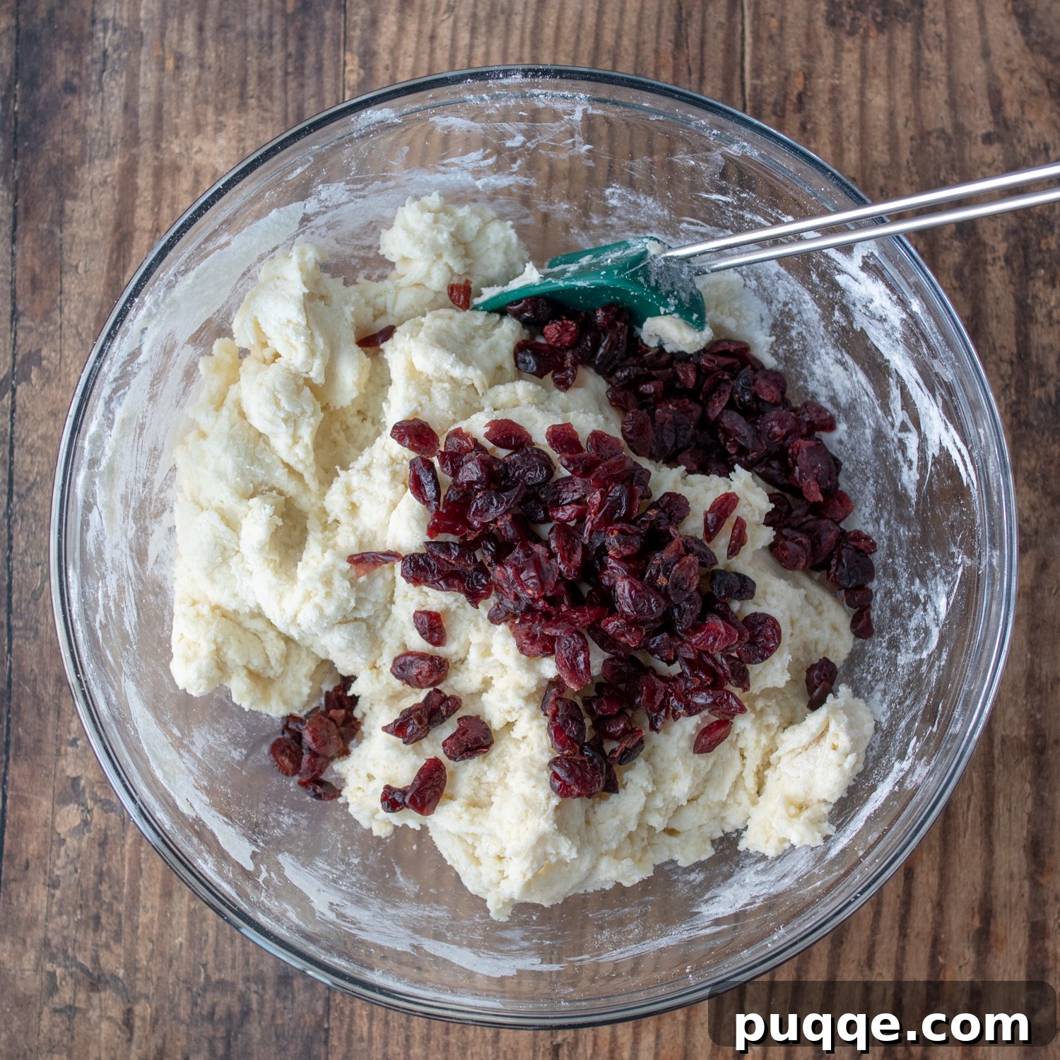 Melt-in-Your-Mouth Sweet Irish Soda Bread 5 Dried cranberries being mixed into the stiff soda bread dough in a bowl.
