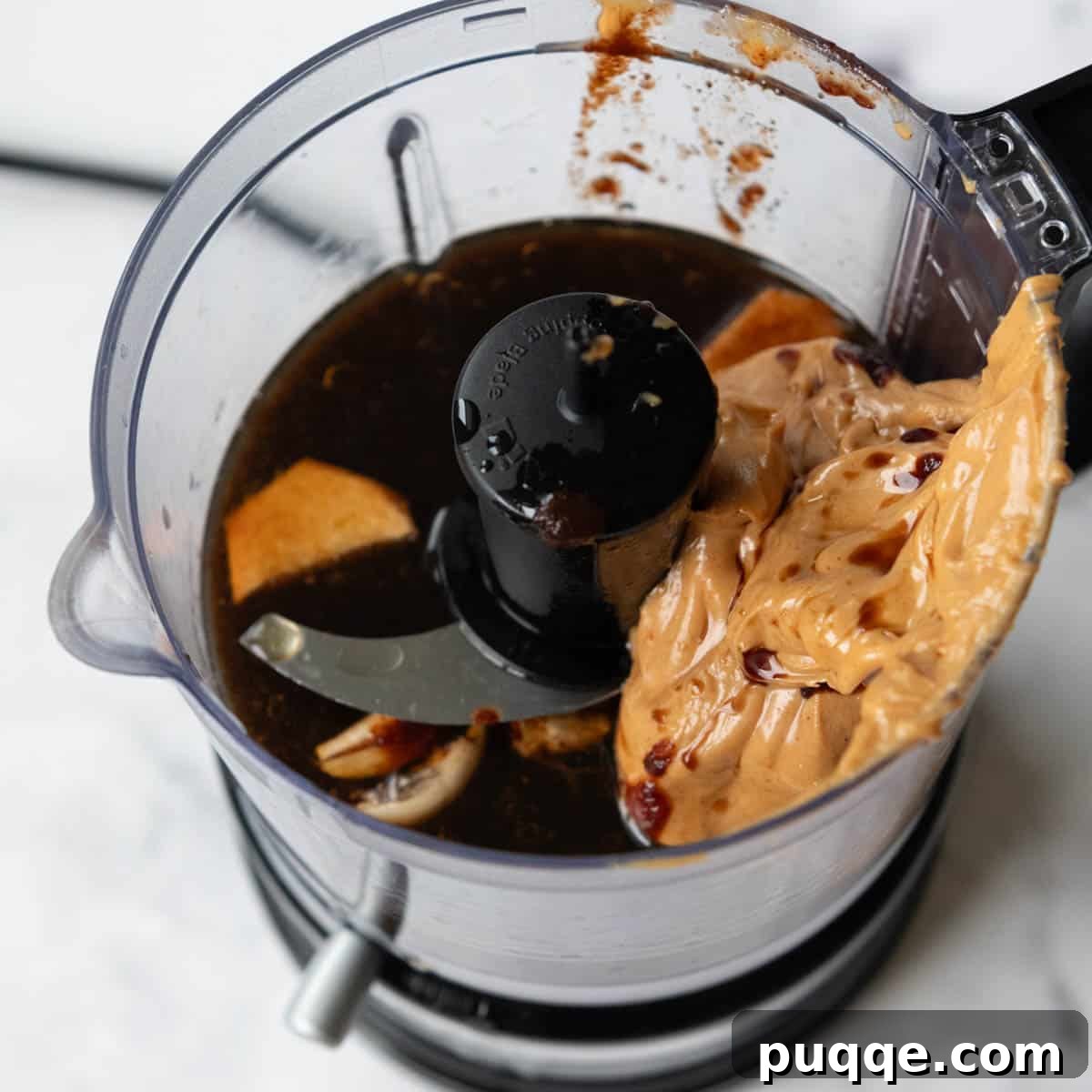 Blended Peanut Sauce Ingredients ingredients for peanut sauce in a small food processor.