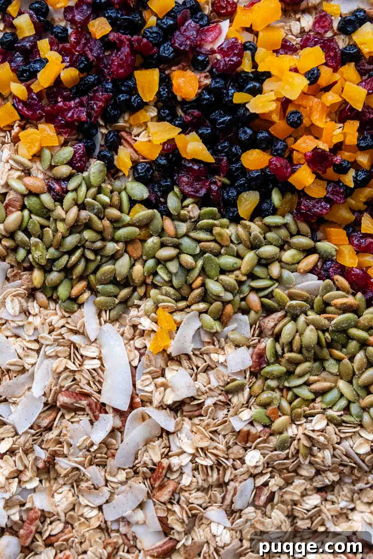 Heavenly Spiced Gluten-Free Muesli Bliss 5 A sheet pan of toasted muesli mixture, with oats, pecans, and coconut flakes evenly spread, ready for cooling and additional mix-ins.