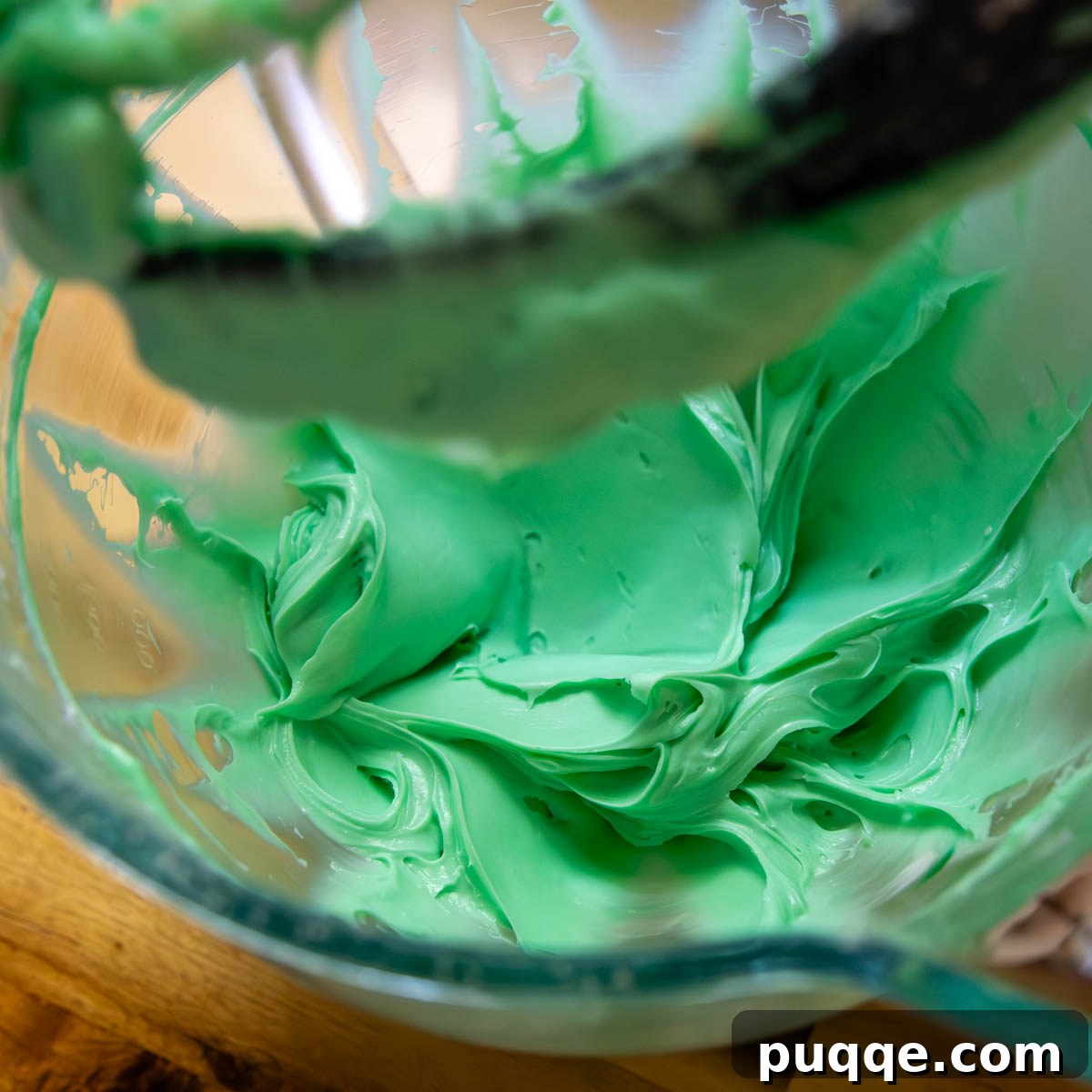 No Bake Chocolate Mint Dream Pie 4 A vibrant green mint filling mixture in a glass bowl, showcasing its smooth and creamy texture.