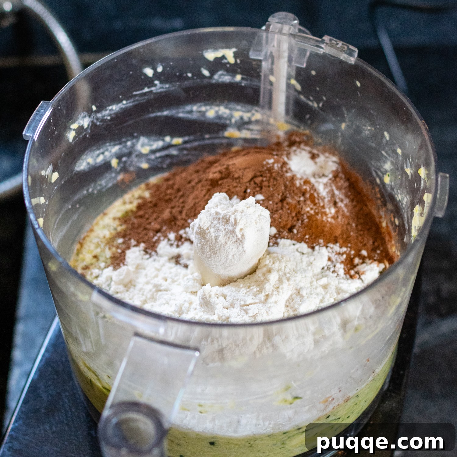 Effortless Gluten Free Zucchini Brownies 4 Dry ingredients, including sugar, cocoa powder, and gluten-free flour, added to the food processor with the wet mixture.