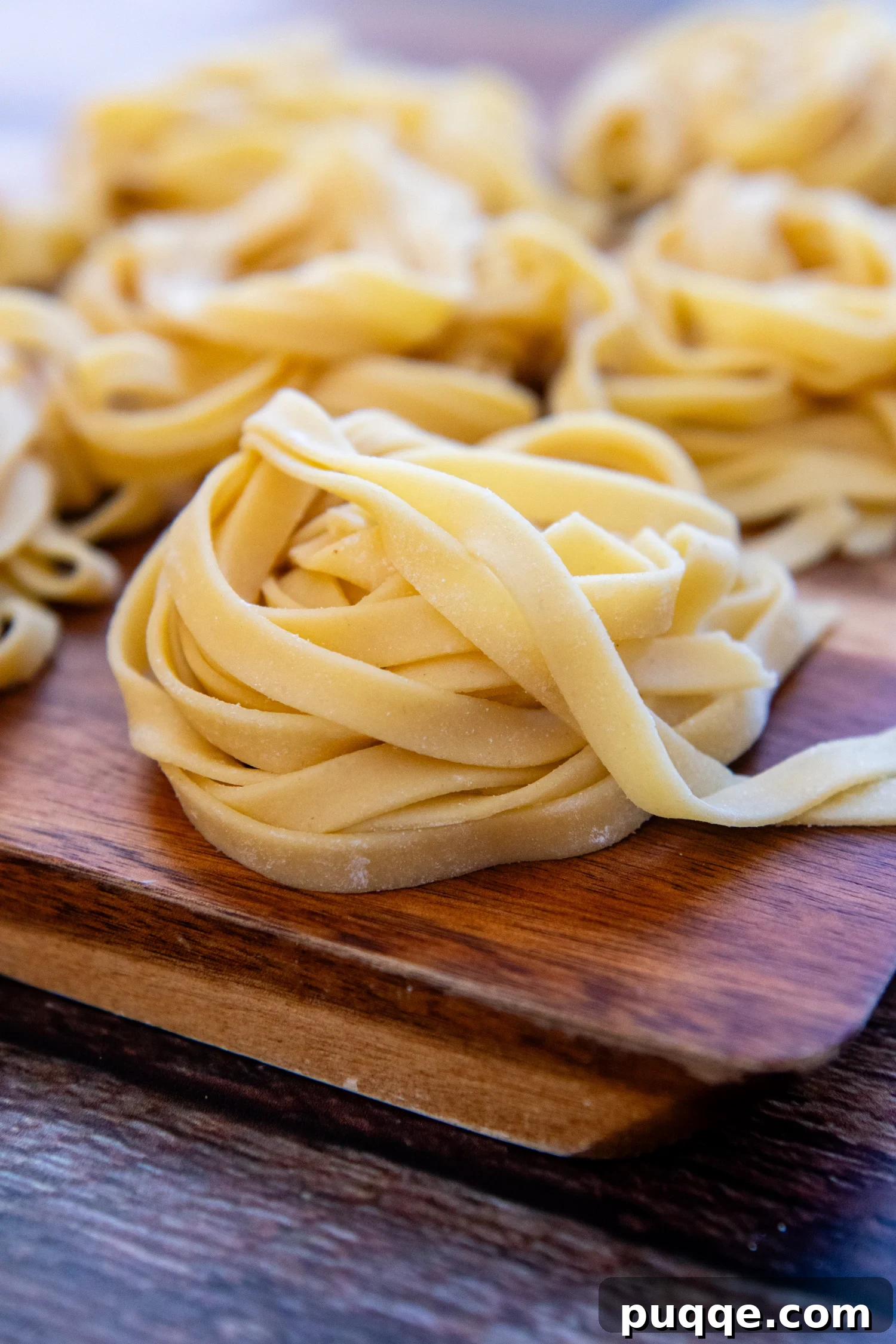 Gluten-Free Pasta folded sitting on a cutting board.