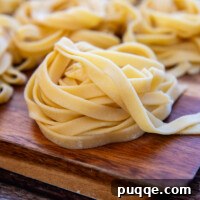 Gluten-Free Pasta folded nested on a cutting board.