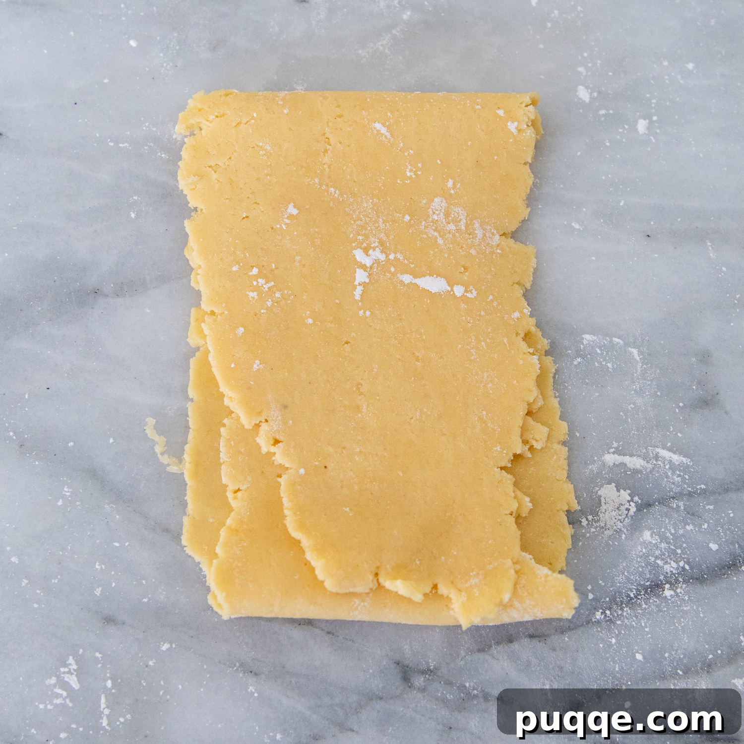 Flattened dough folded in thirds.