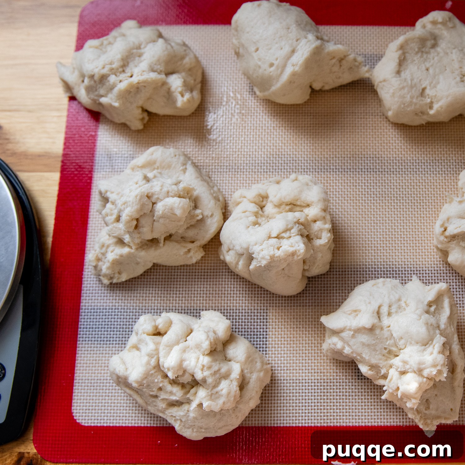 Dough balls on a baking mat.