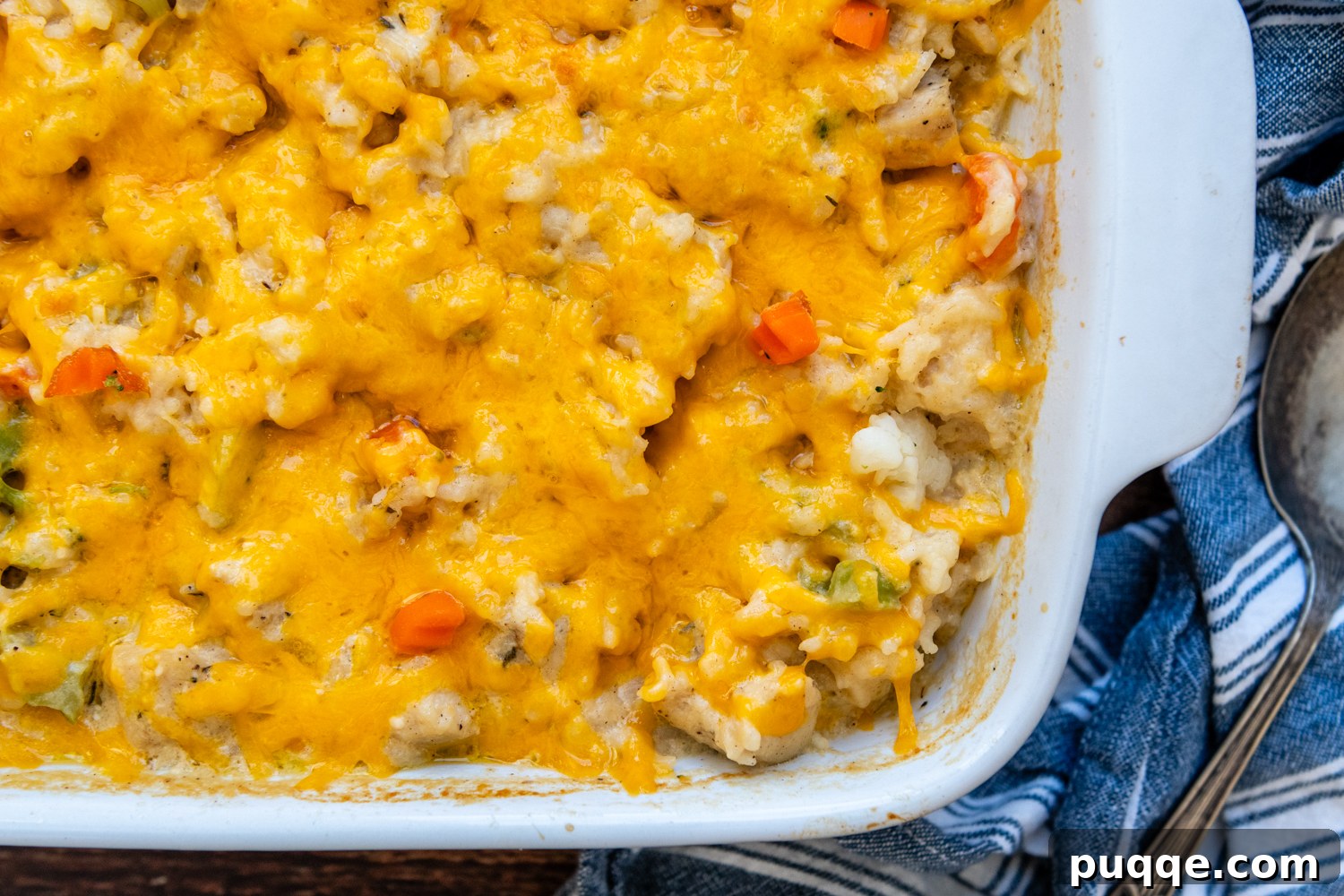 Wholesome & Creamy Gluten-Free Chicken Bake 8 A large white baking dish filled with golden, bubbly Gluten-Free Chicken Rice Casserole, fresh from the oven, ready to be served.