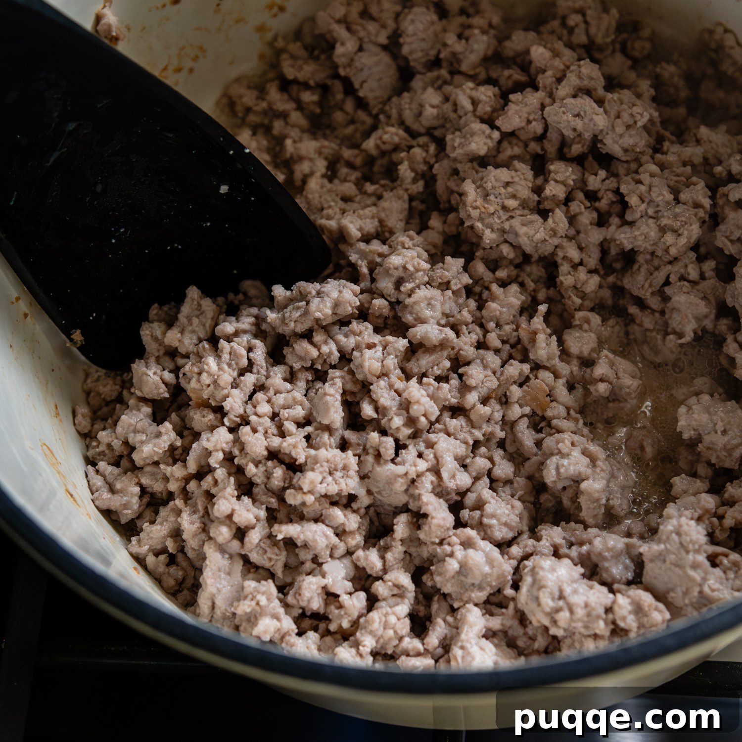 Quick & Creamy Gluten-Free Coconut Ramen Bliss 4 Ground pork being broken up and browned.