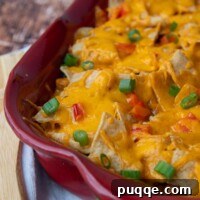a close up of mexican chicken casserole with melted cheese on top