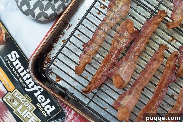 cooked bacon on a baking sheet