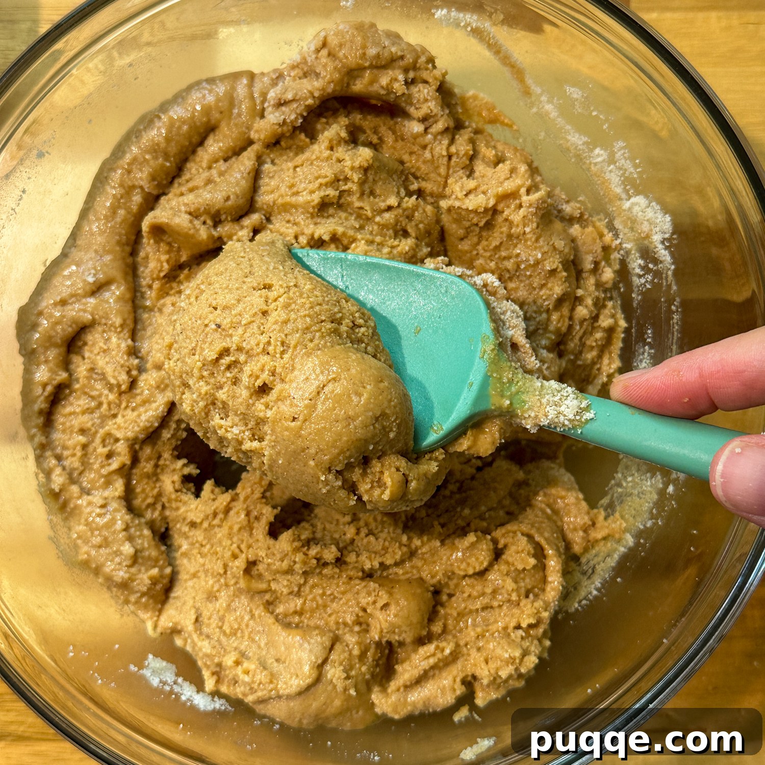Thick peanut butter mixture in a large bowl, ready to be pressed into the pan.
