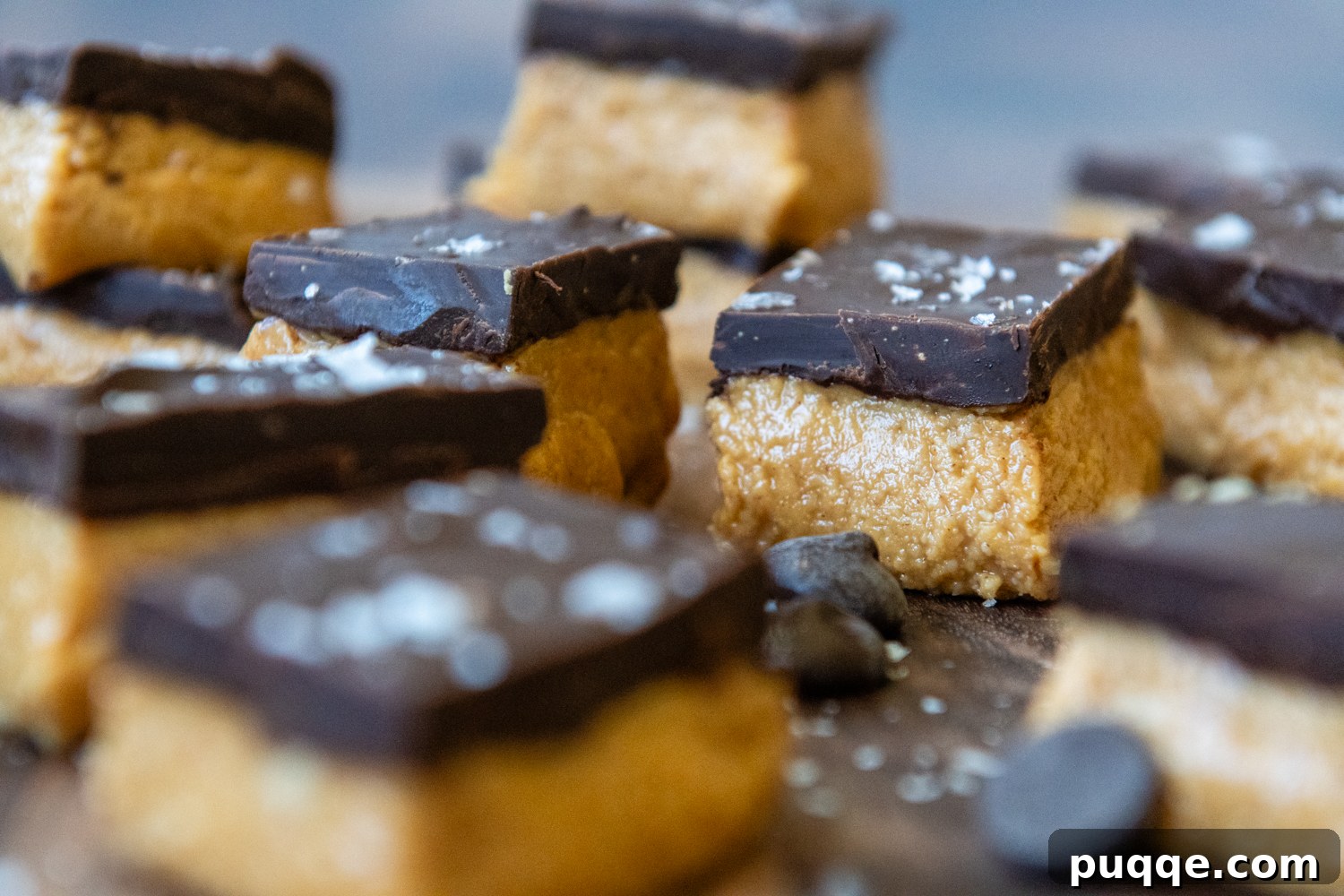 Delicious gluten-free peanut butter bars with smooth peanut butter and rich chocolate, sliced and arranged.