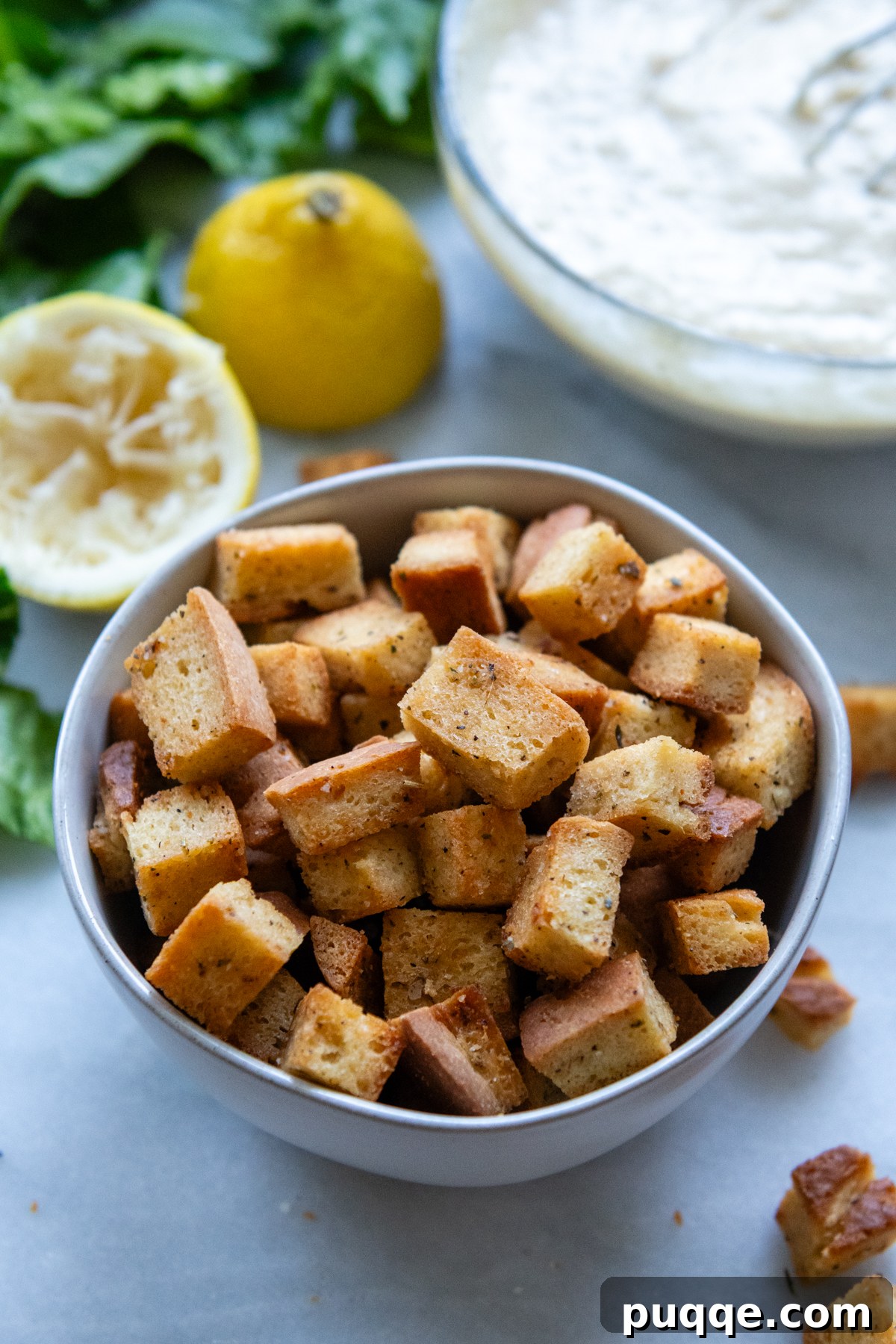 A bowl overflowing with golden, homemade croutons, perfect for any salad.