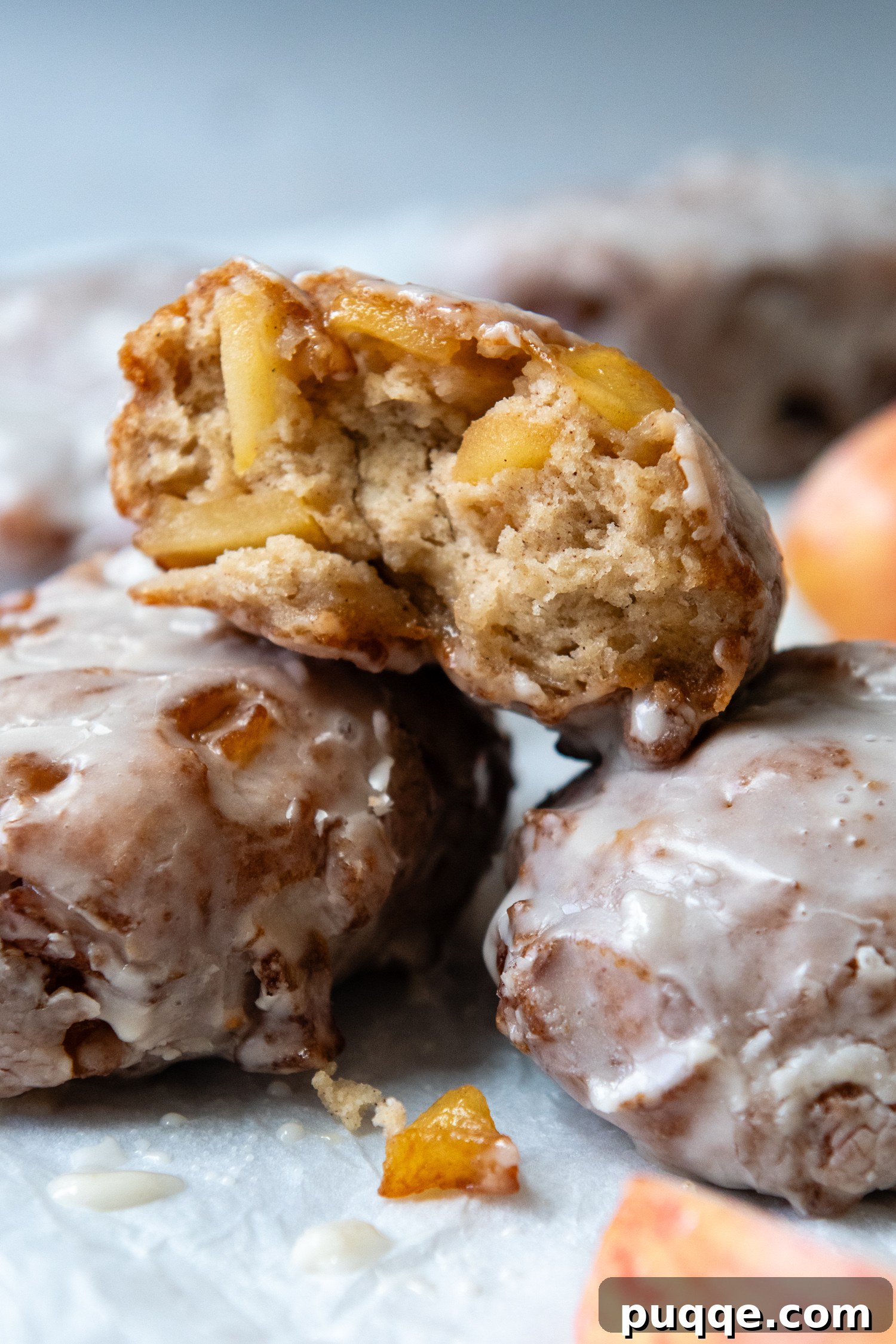 No-Fuss Gluten-Free Apple Fritters 11 3 apple fritters piled on one another with one showing the inside texture.