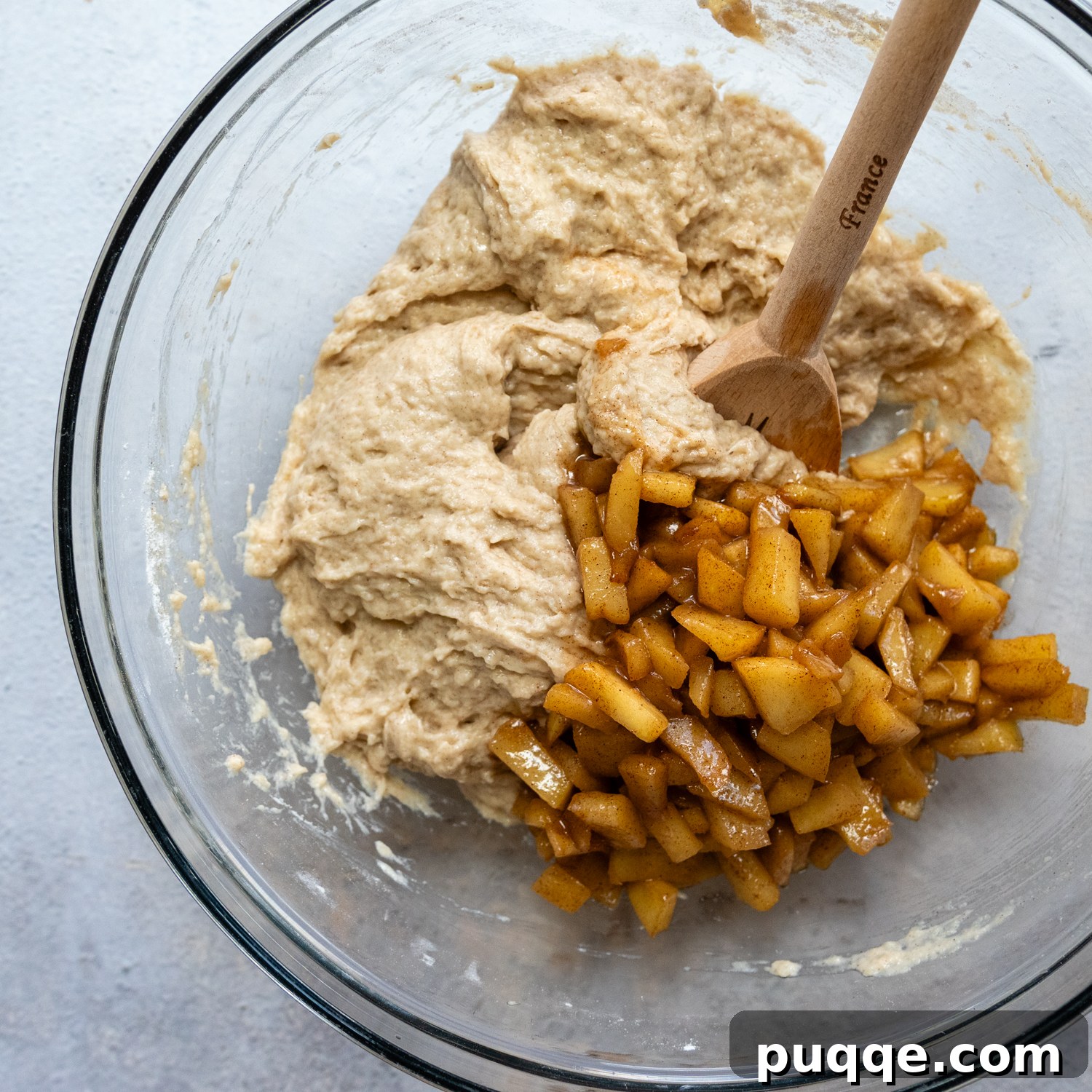 No-Fuss Gluten-Free Apple Fritters 5 Dough and apple pieces in a glass bowl.