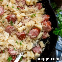 Hearty Gluten-Free German Dumplings and Sausage 11 Gluten-free dumplings and sausage with sauerkraut in a cast iron skillet.