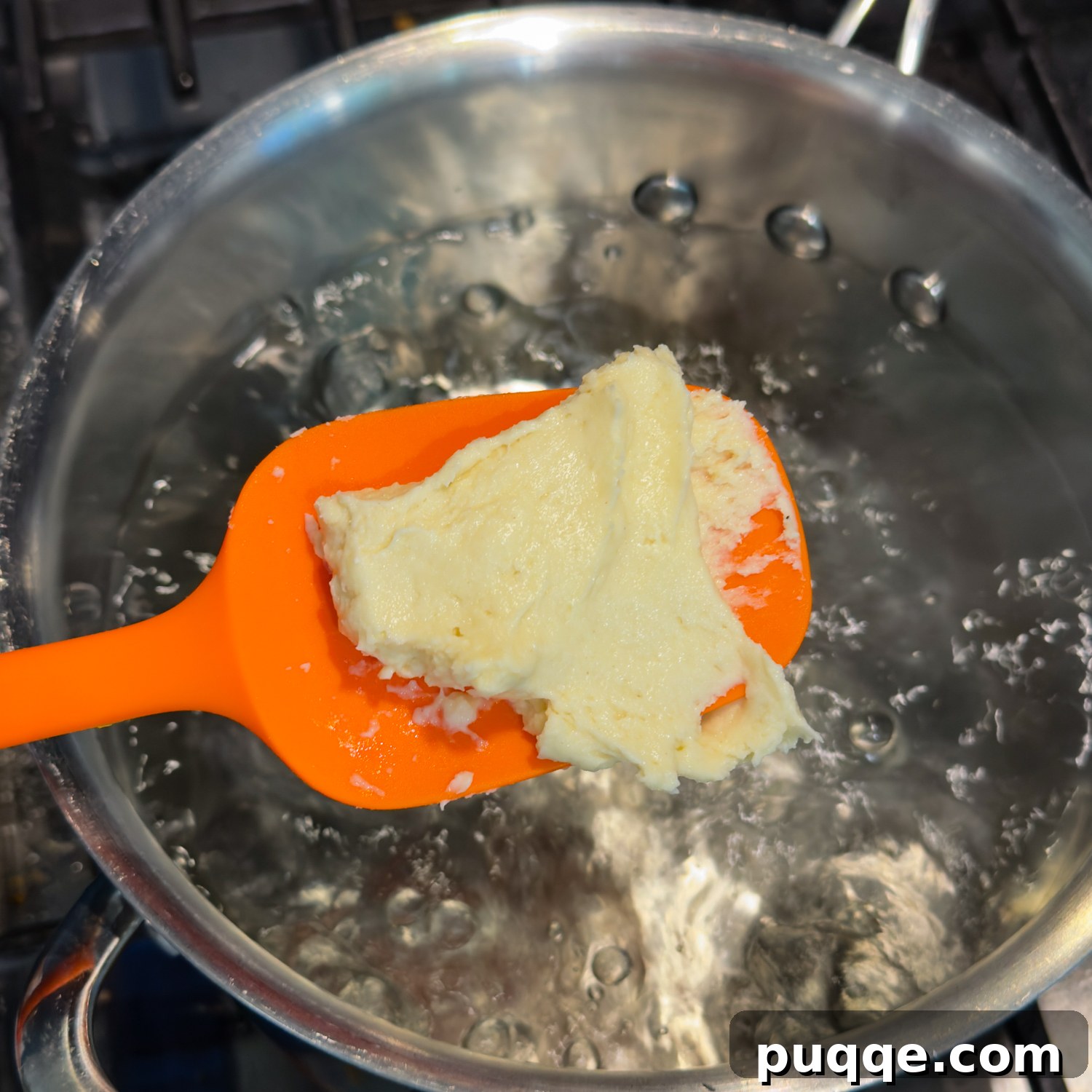 Hearty Gluten-Free German Dumplings and Sausage 4 Scooping gluten-free dumpling dough into boiling water for cooking.