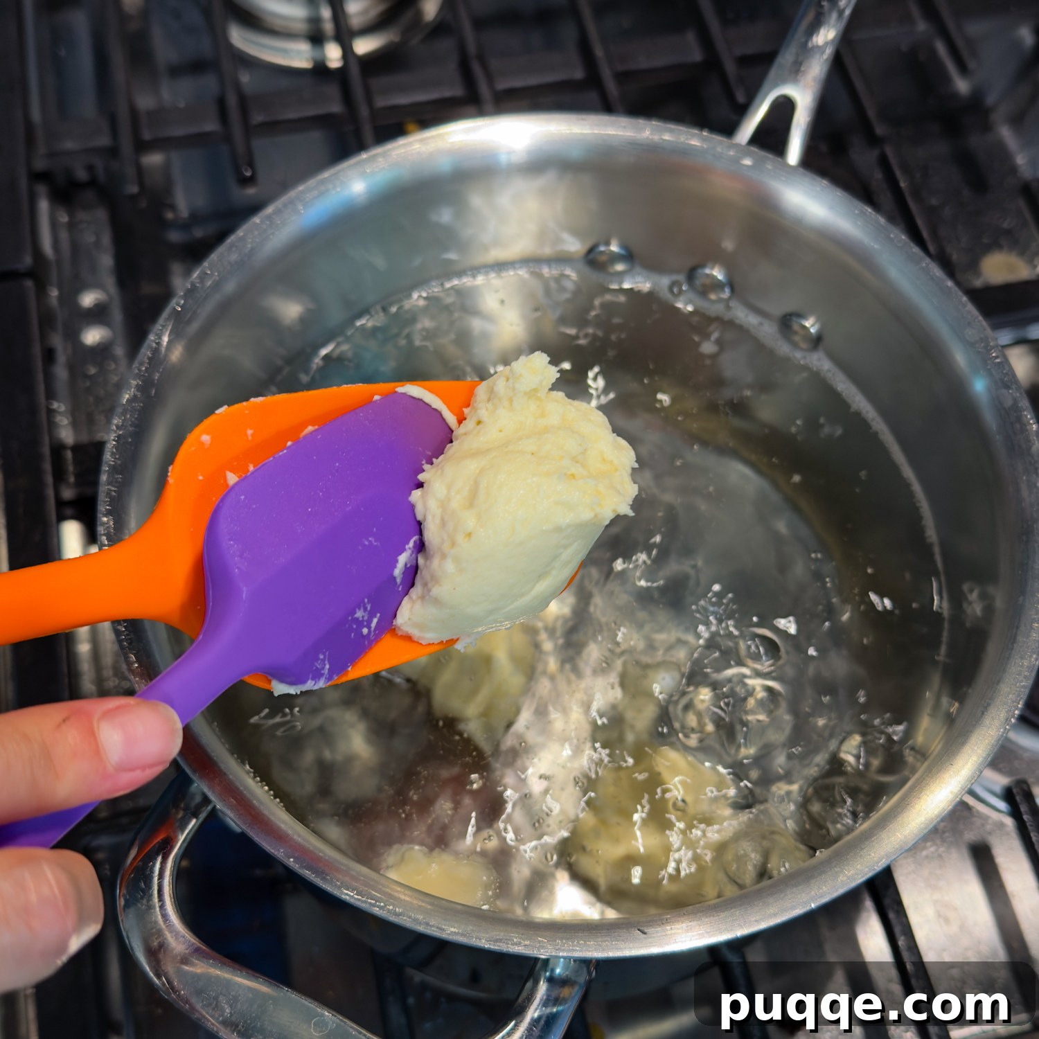 Hearty Gluten-Free German Dumplings and Sausage 5 A second spoon assists in dropping gluten-free dough into hot water for boiling.