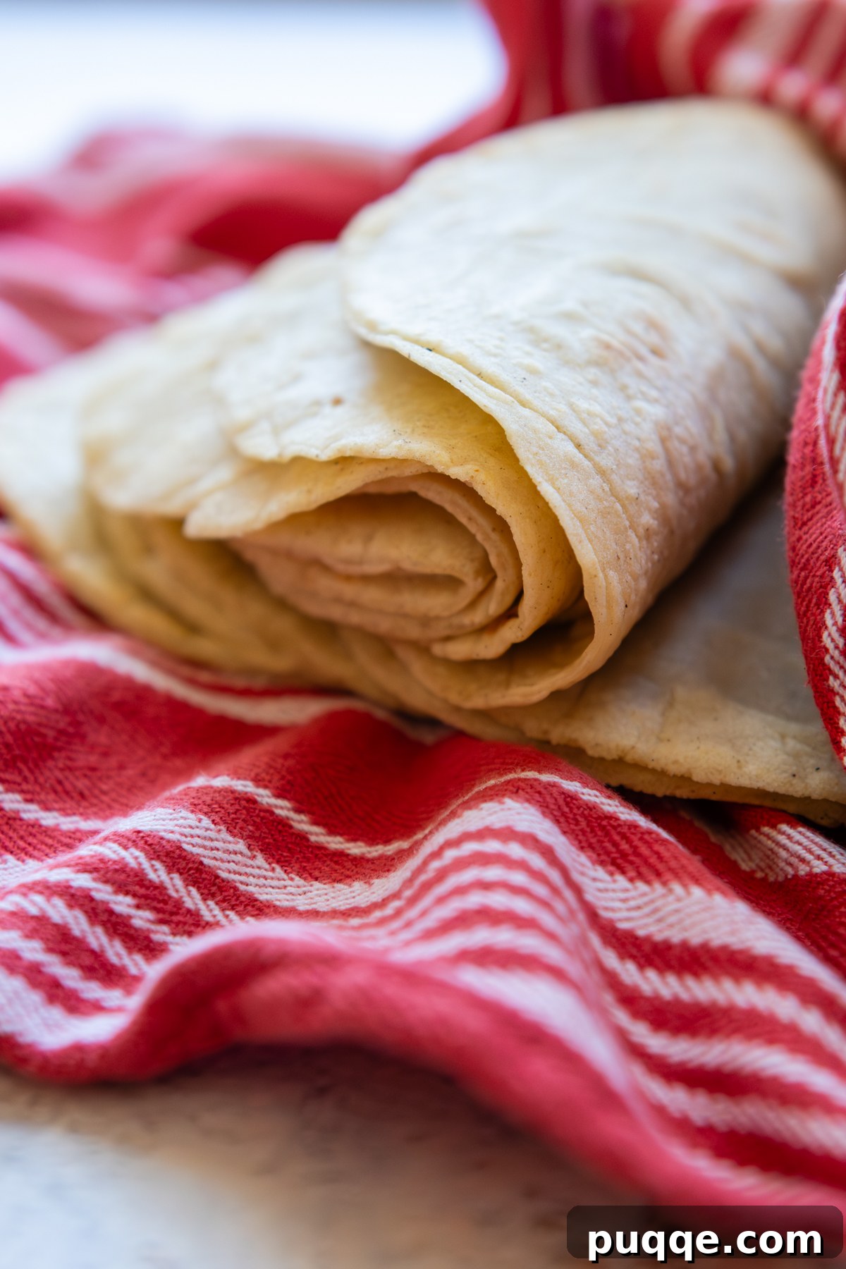 Tortillas folded laying on a town.