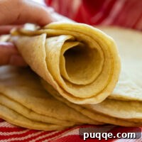 Rolled up stack of gluten free corn tortillas.