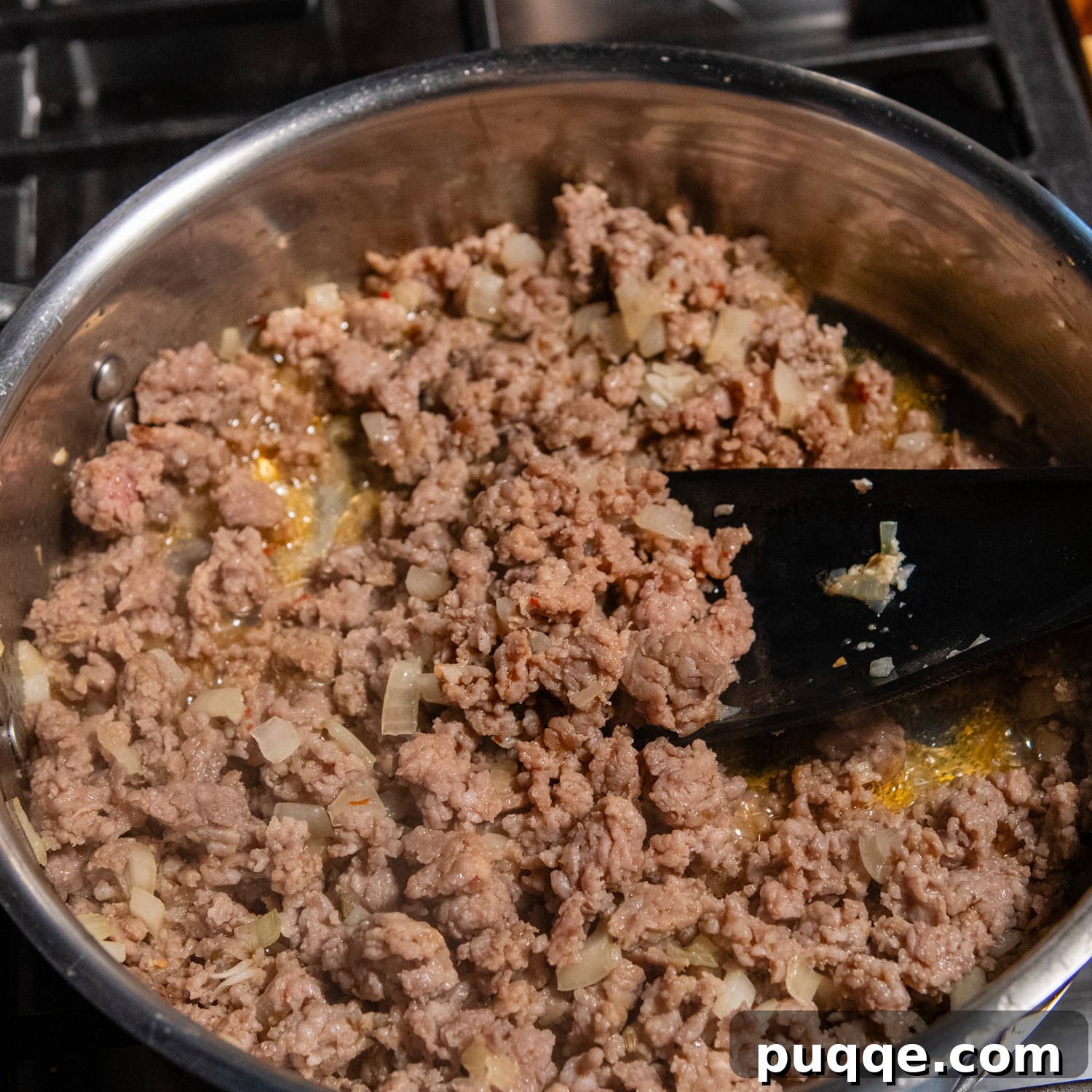 Scrumptious Gluten-Free Spaghetti Bake 5 Italian sausage in a metal pan.