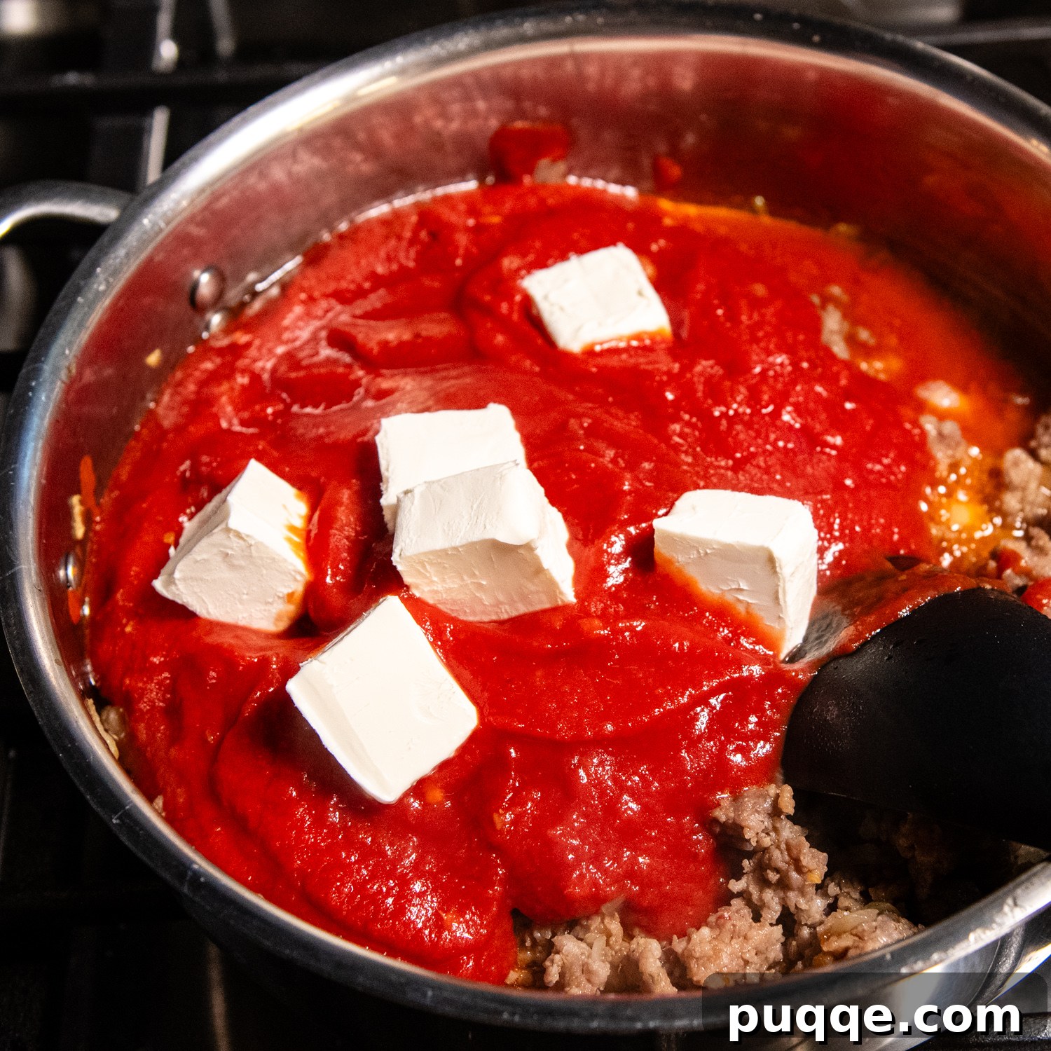 Scrumptious Gluten-Free Spaghetti Bake 6 Spaghetti sauce and cream cheese in a sauce pan.