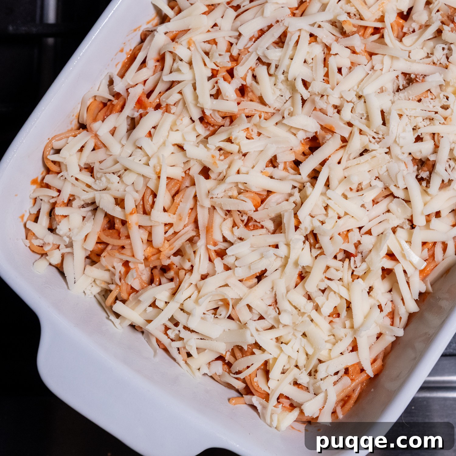 Scrumptious Gluten-Free Spaghetti Bake 7 Pre-cooked assembled casserole in a baking dish.