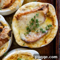 Easy Gourmet Gluten-Free French Onion Soup 13 Overhead shot of French Onion Soup in a white soup crock topped with parsley.