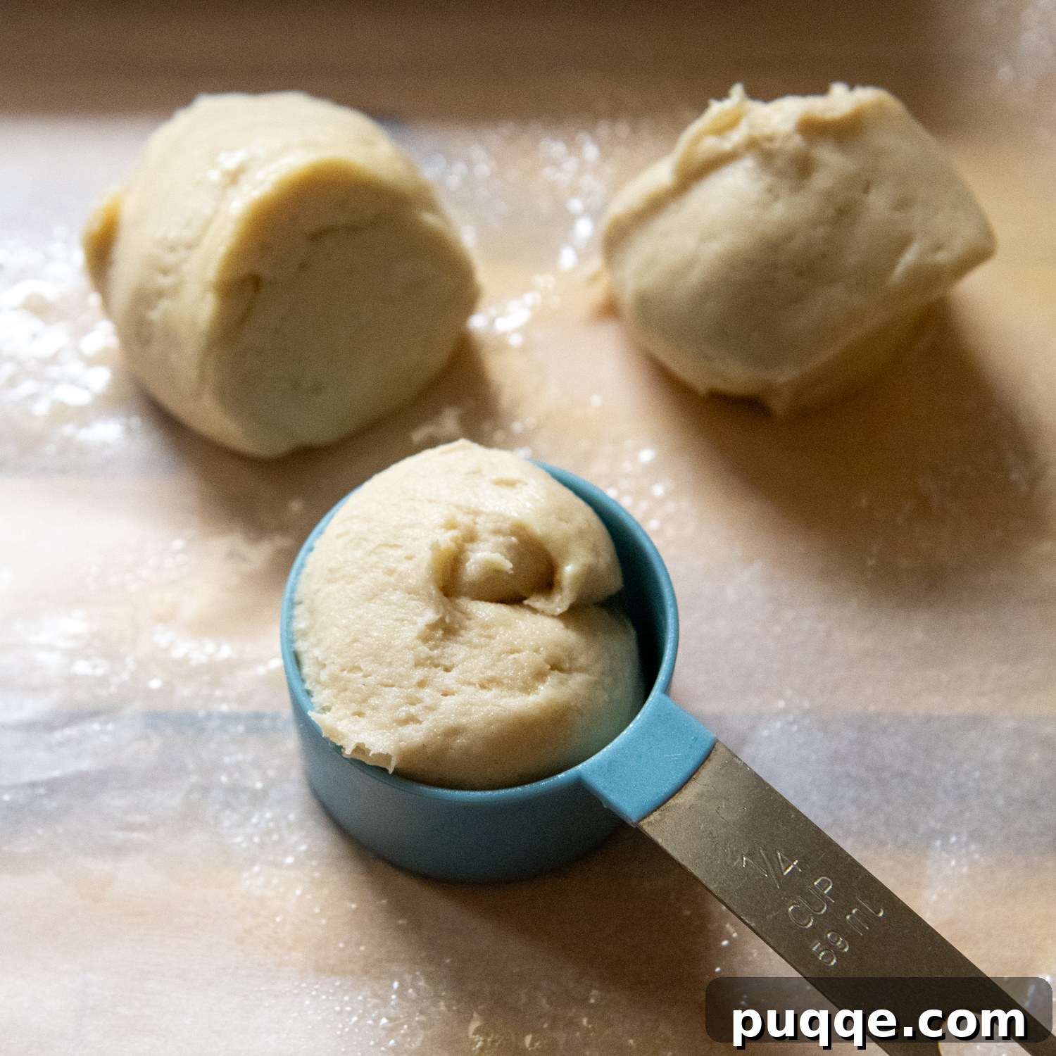 Gluten-Free Hawaiian Rolls: Squishy Soft in Just One Hour 4 A scoop of sticky gluten-free Hawaiian roll dough in a greased measuring spoon, demonstrating the texture.