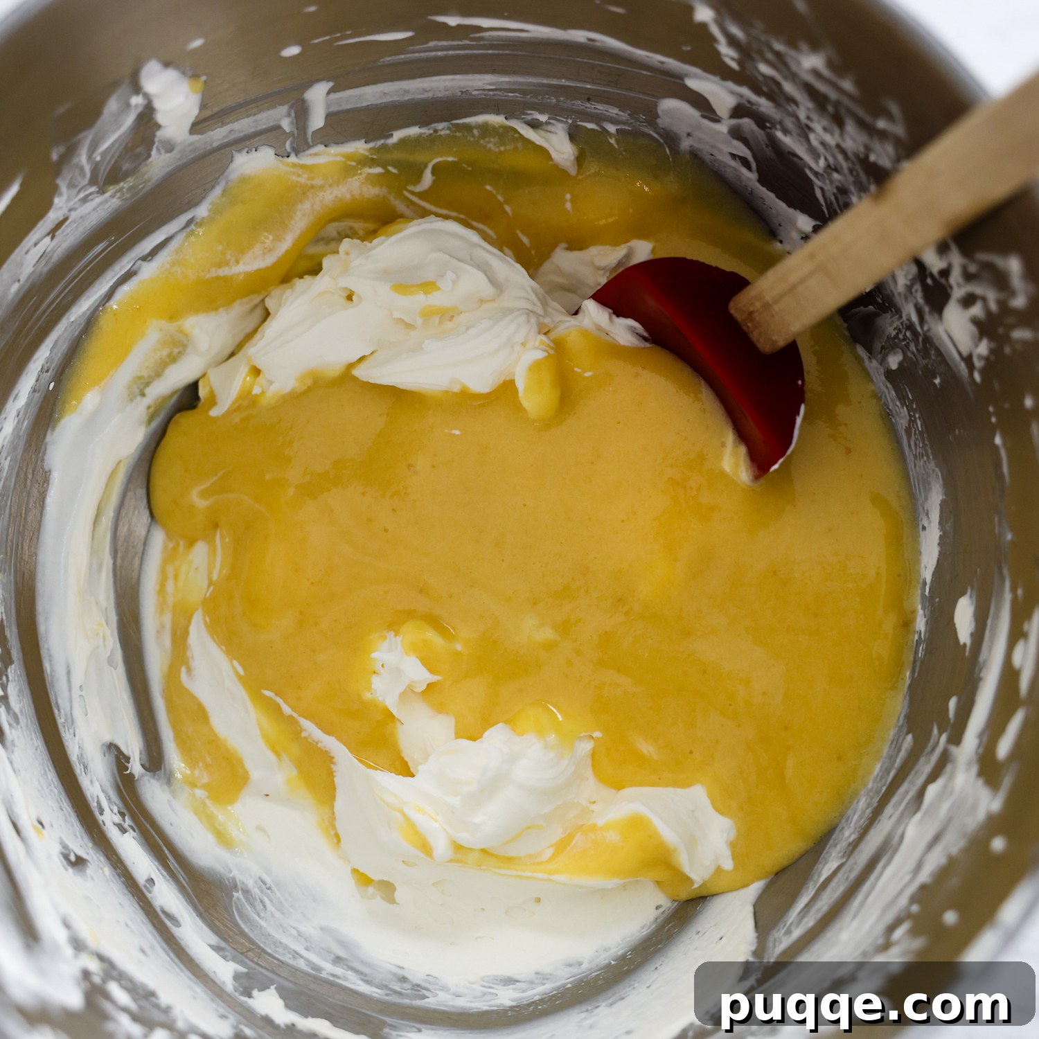 Unforgettable Gluten-Free Tiramisu Made Easy 5 Chilled egg custard being gently folded into the mascarpone and whipped cream mixture.
