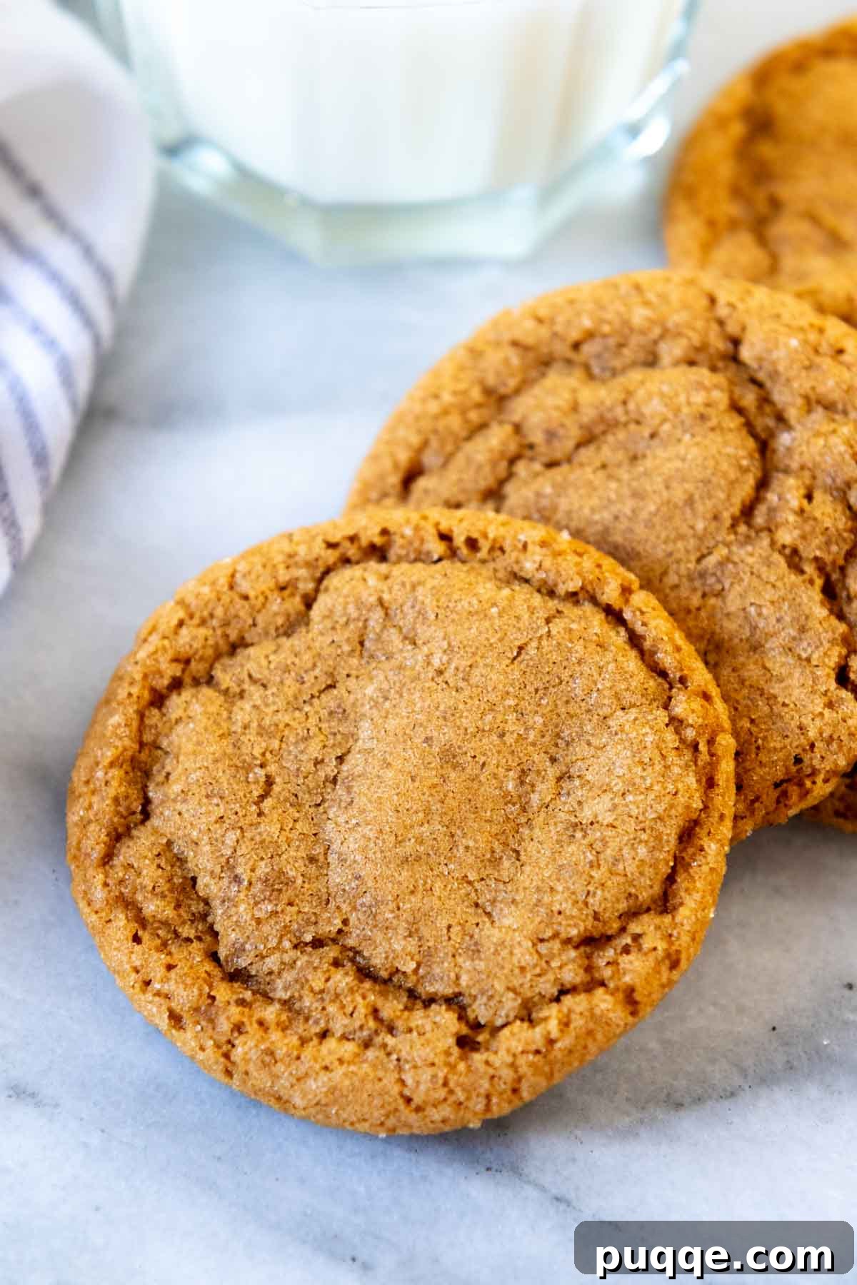 Gluten-free ginger snaps perfectly arranged next to a glass of milk, inviting a cozy experience.