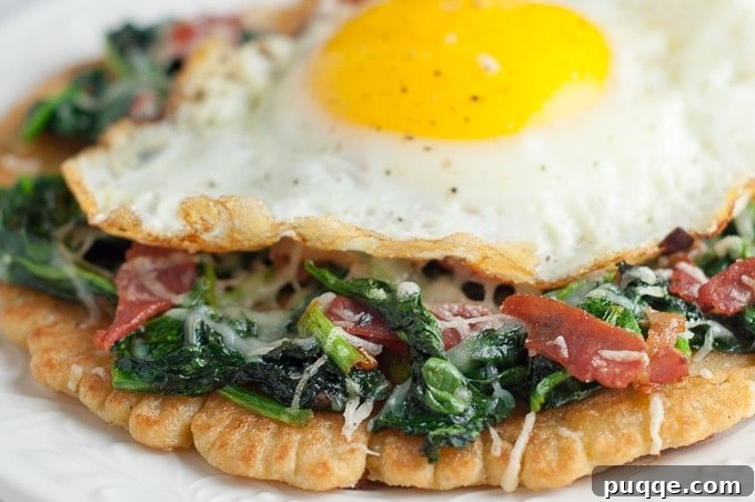 Savory Prosciutto, Spinach and Egg Farinata 4 a close up of the spinach and prosciutto topping on the farinata pizza