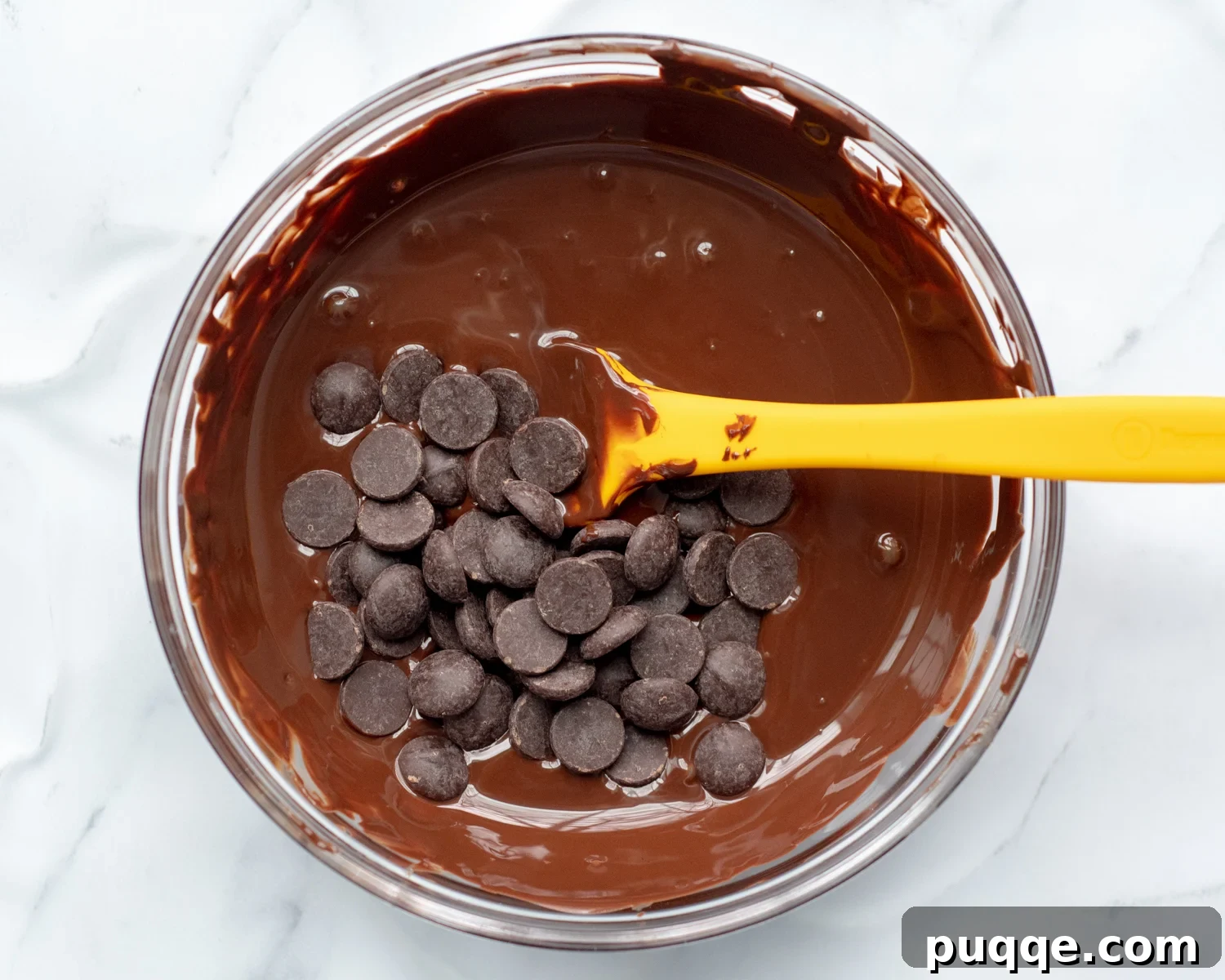 Gluten-Free 3-Ingredient Chocolate Peanut Butter Bark 4 Chocolate chips in a bowl of perfectly melted, glossy chocolate, ready for the next step.