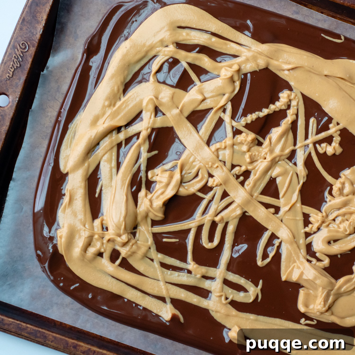 Gluten-Free 3-Ingredient Chocolate Peanut Butter Bark 5 Melted peanut butter drizzled in an artistic pattern on top of the smooth, dark chocolate base.