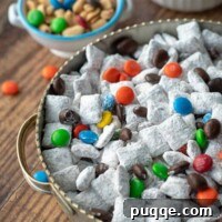A close-up shot of Nutella puppy chow in a bowl, perfect for a recipe card thumbnail.