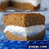 a slice of homemade oatmeal creme pie on a blue plate facing straight on