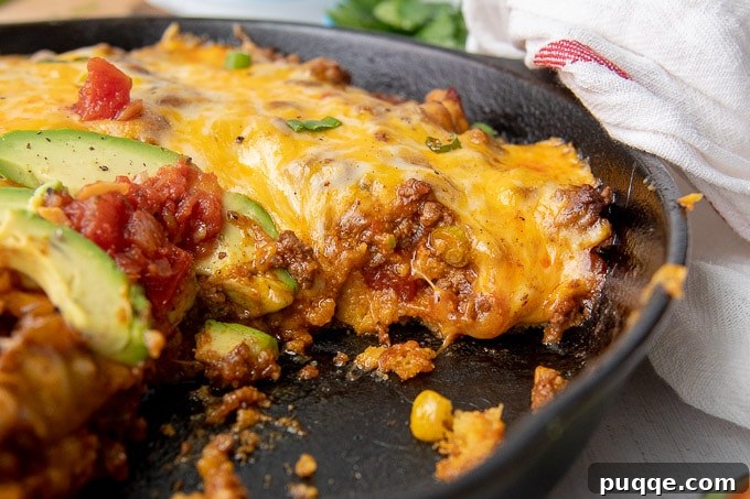 Authentic Gluten-Free Tamale Pie Made From Scratch 7 A close-up side view of a sliced Tamale Pie, showing the distinct layers and texture.