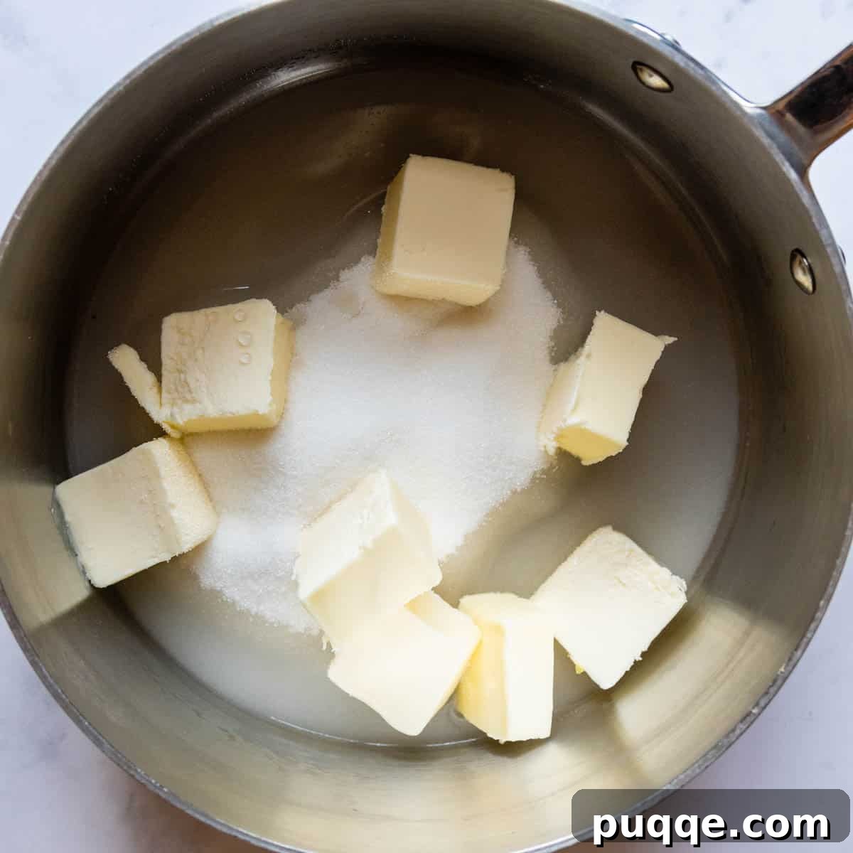 Perfectly Fudgy Gluten-Free Brownies with Crackly Tops 4 Cubed butter and granulated sugar combined in a saucepan, ready to be melted for the brownie base.