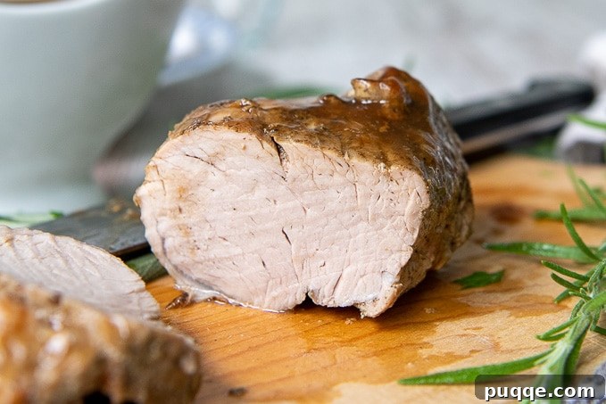 instant pot pork tenderloin on a wooden cutting board 