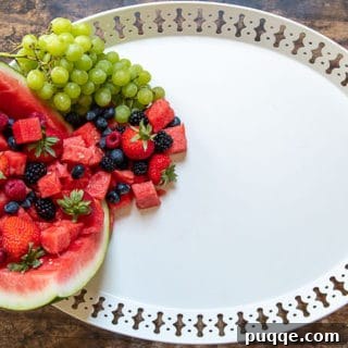 how to make a dessert platter second step - filling watermelon with fruit