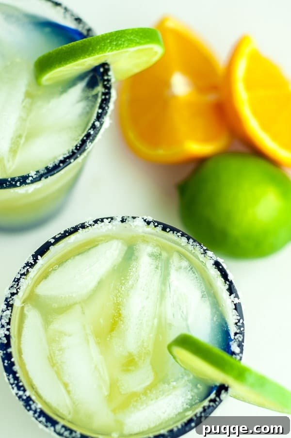 Freshly Crafted Lighter Margarita Recipe 3 an overhead shot of two glasses of skinny margarita