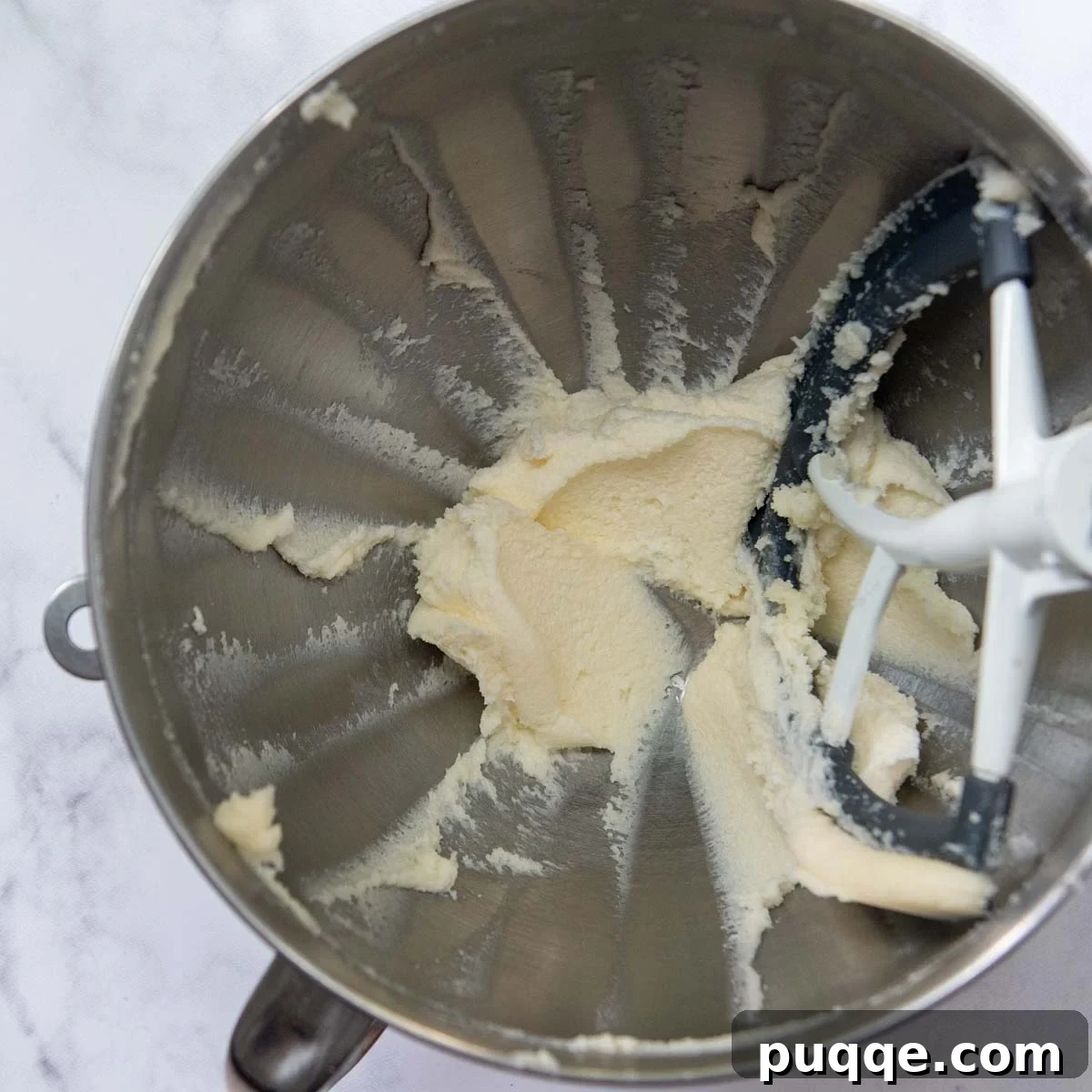 Flawless Gluten-Free Cut-Out Sugar Cookies 3 Butter and sugar creamed together in a mixing bowl, showing a light and fluffy texture.