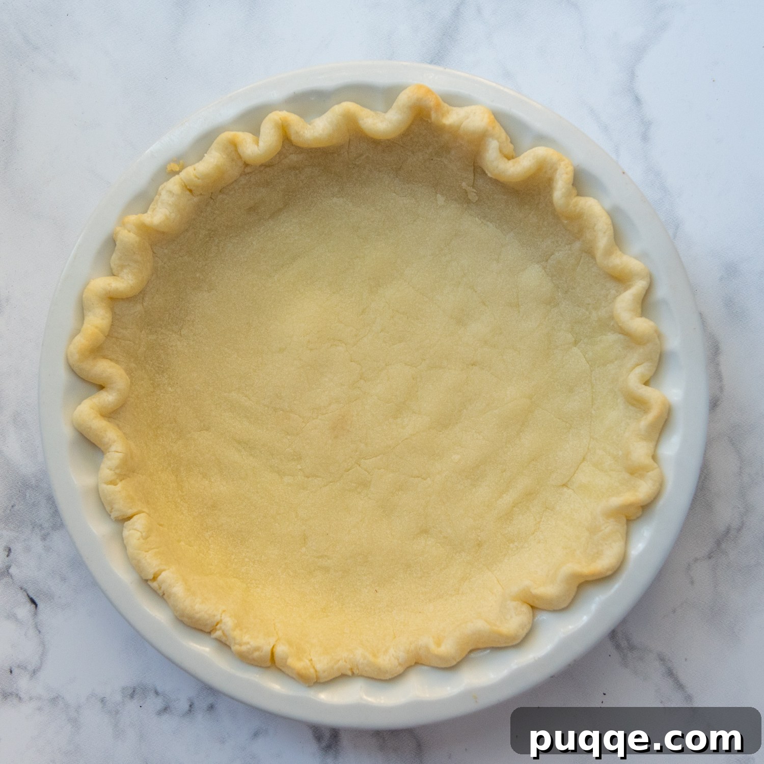 Decadent Southern Chocolate Chess Pie 3 an unfilled pie crust shot from overhead.