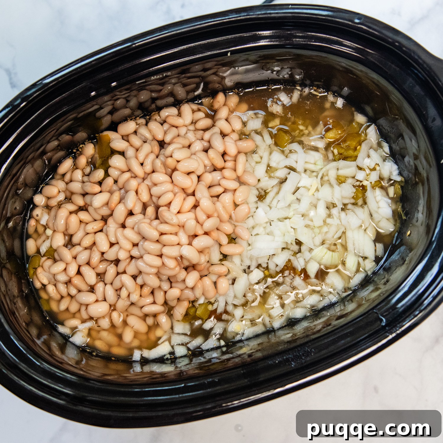 Gluten-Free White Chicken Chili The Secret to Its Deliciousness 3 All the ingredients layered neatly in a crock pot, ready for slow cooking.