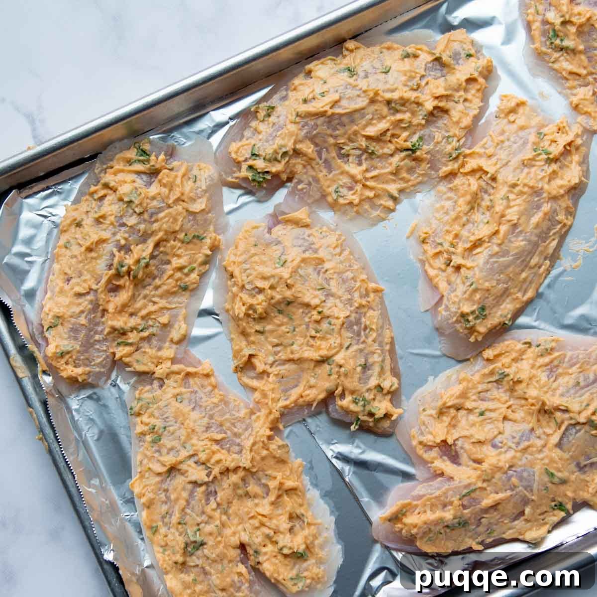 the topping spread on the tilapia.