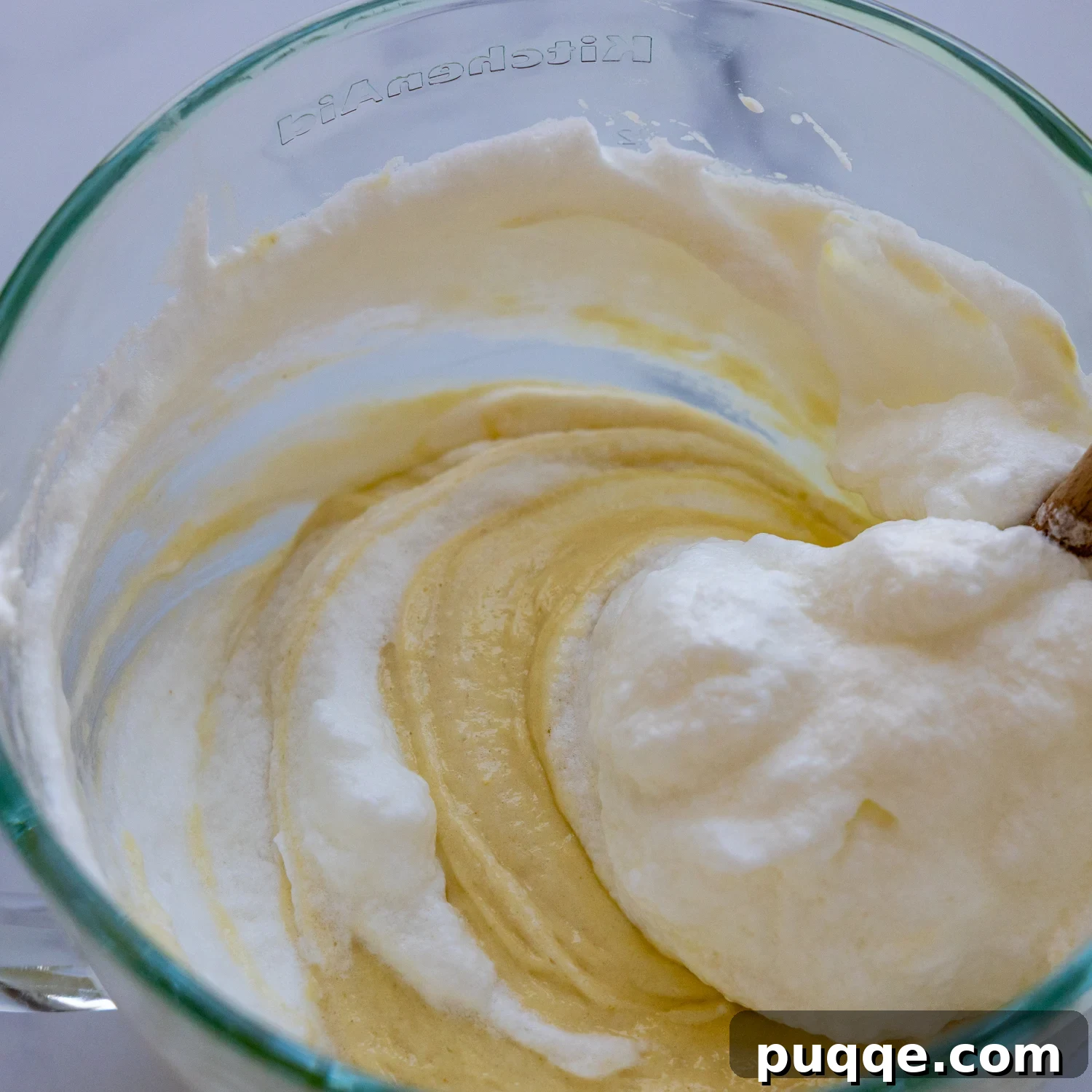 Absolutely Perfect Gluten-Free Tres Leches Cake 5 The combined cake batter in a mixing bowl, showing its light and fluffy consistency.